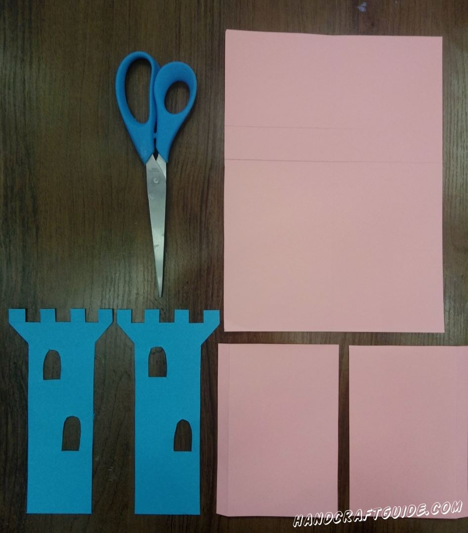 For the beginning we will cut out, from a blue paper, 2 towers with windows.